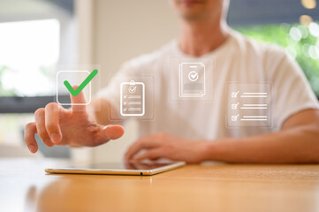 businessman using tablet and virtual document Online survey filling out, digital form checklist in Business performance monitoring concept, smart checklist on virtual screen