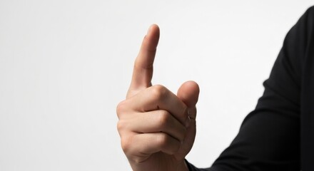 Hand pointing upwards, index finger extended against a white background