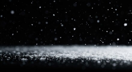 Snow falling gently on a dark surface, bokeh effect