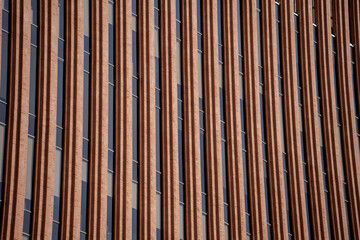 Modern red brick facade with vertical pattern