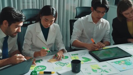 Top down view of business team discussing about using clean energy and sustainable investment at meeting table with wind mill, document with environmental graph and wooden house model. Alimentation. - Powered by Adobe