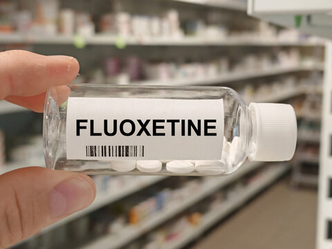 Box of FLUOXETINE tablets on a hospital pharmacy table used to treat depression OCD and bulimia an SSRI antidepressant.