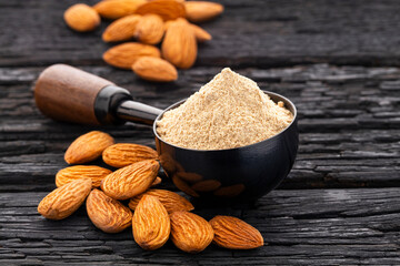 Crushed almonds in a spoon - Prunus dulcis