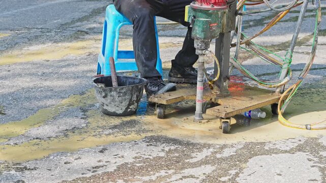 Workers using machinery to maintain the highway