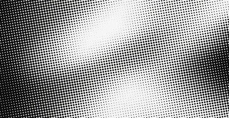 Vector illustration of a monochrome halftone background with a fading dot gradient effect. Retro pop-art pattern template ideal for graphic design, grunge texture overlay, or comic background.