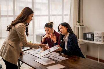 Businesswomen arguing about negative financial results during a meeting