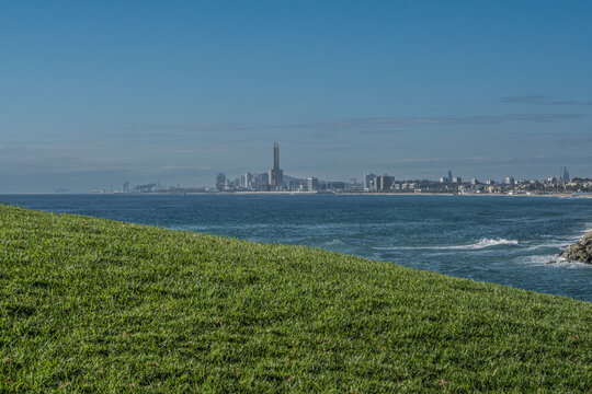 Barcelona skyline over the mediterranean sea from green hill.