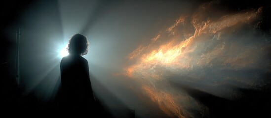 Fototapeta premium A silhouetted person faces a bright light and nebulous, fiery clouds