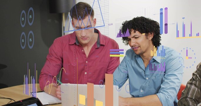 Collaborating three colleagues analyzing data at conference table, with laptop, notebook and pen