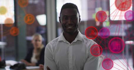 Smiling man wearing white shirt folding arms in office, with glass partitions and network overlay