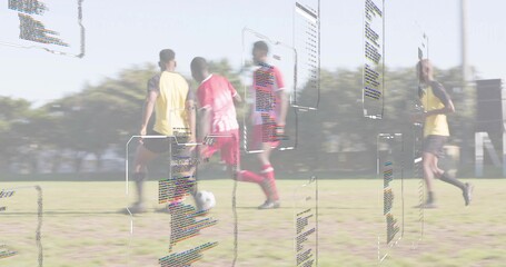 Competing athletes in red and yellow kits on grass pitch, featuring soccer ball and code panels
