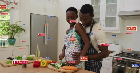 Cooking couple chopping cucumbers as Play icon popping subscribe icons surrounding them for growth - Powered by Adobe
