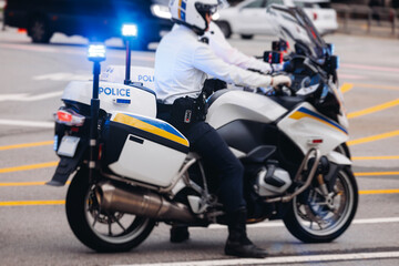 Obraz premium Korean traffic police squad formation on the road, riding bike and motorcycle, highway patrol maintain public order in the city streets of Seoul, South Korea, policemen motorbikes with sirens pursuit