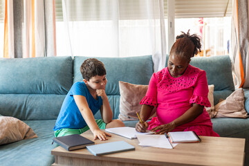 A pregnant woman teaching several subjects at home