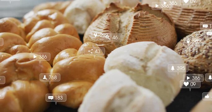 At second mark camera panning over bread array with icons rising and changing showing engagement