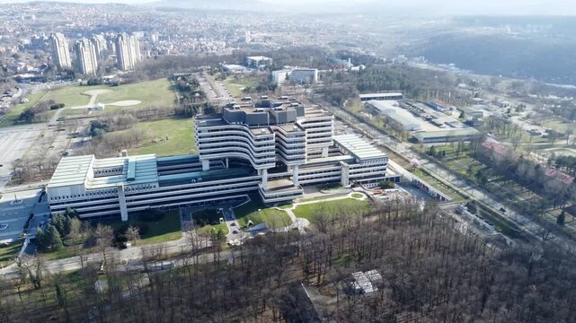 Aerial view of Military Medical Academy building complex in Belgrade surrounded by city landscape. g.