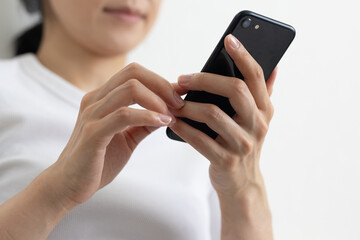 Close-up of smartphone held by woman