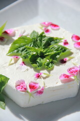 Flavored cream cheese with basil, tomato, and garlic—smooth, savory, and ideal as a Mediterranean-inspired gourmet spread.