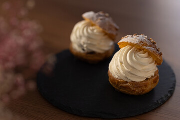 Cream puffs in moody lighting with afternoon sunlight