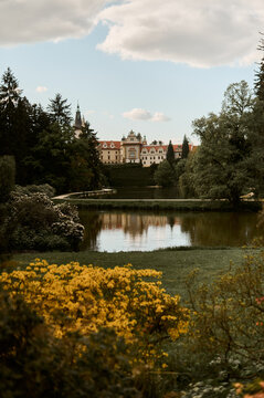 Romantic castle view over garden lake