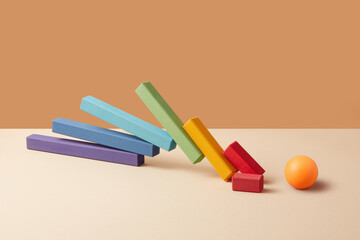 Domino chart halted by orange ball obstacle