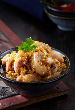 Closeup of dish, spicy and sour pig's trotters with pickled peppers