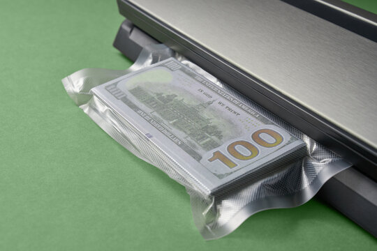 Vacuum sealer with hundred dollar stack