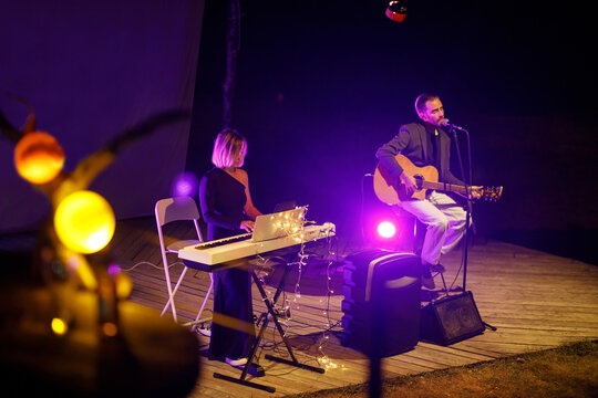 Cover band plays music at a night performance