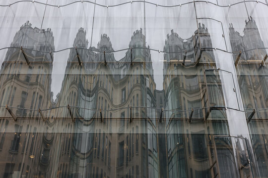 Distorted building reflection on glass facade