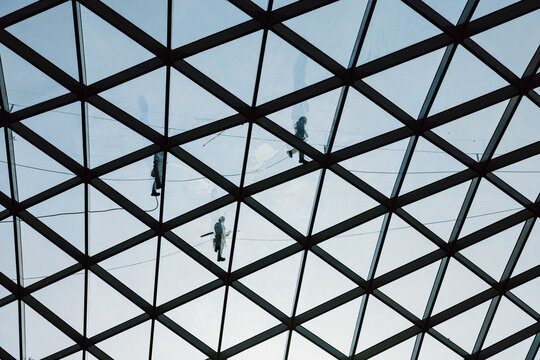 Workers Cleaning Large Glass Roof