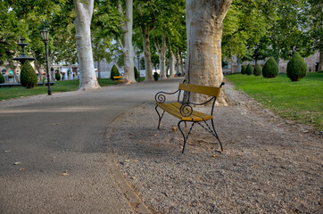 Zagreb, Croatia – July 18, 2025: The Art Pavilion in King Tomislav Square is illuminated by warm morning light, standing behind manicured lawns and red flower beds.
