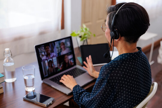 Woman on video call working from home.
