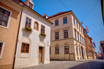 Zagreb, Croatia – July 18, 2025: Historic façades, government buildings, and narrow streets showcase the distinctive architectural character of Zagreb’s Upper and Lower Towns.
