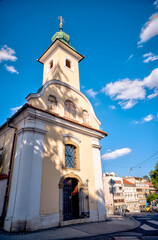 Fototapeta premium Zagreb, Croatia – July 18, 2025: The Baroque-style Chapel of Saint Dismas (Kapelica sv. Dizme) in Zagreb’s Upper Town glows in the afternoon light. 