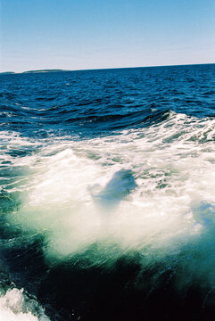 Shadow of Flag on Ocean from Boat