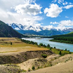 Obraz premium River flows to snowy peaks under a cloudy blue sky