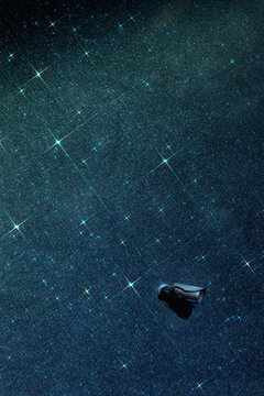 security camera against glitter space wall