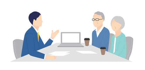 窓口でお客様の接客をするビジネスパーソン