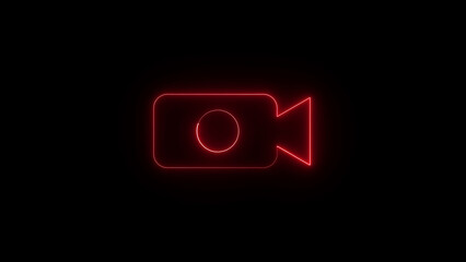 Vibrant red neon video camera icon glowing brightly against a deep black background symbolizing recording and digital media