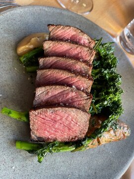 Beautiful slices of steak on a table 