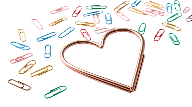 Large rose gold heart paper clip with a scatter of vibrant multicolored office supplies isolated on transparent background