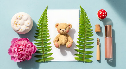 Flat lay composition featuring teddy bear fern flower and cosmetics