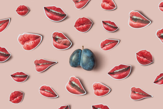 Plum surrounded by many red lips cutouts