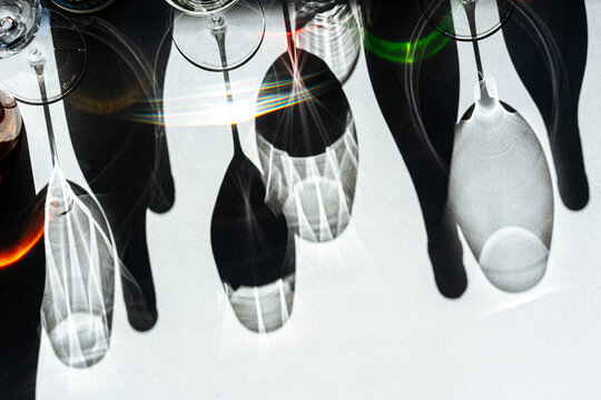 Abstract shadows of wine bottles and glasses with light