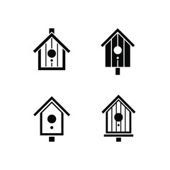 A collection of four simple birdhouse vector icons. Minimalist black silhouettes representing home, nature, and shelter for birds, isolated on a white background