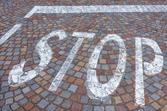 Road markings on cobblestones