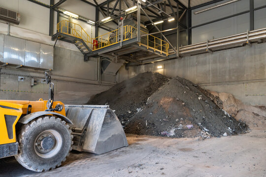 Heavy machinery at waste incineration site