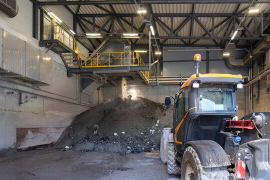 Heavy machinery at waste incineration site at power plant