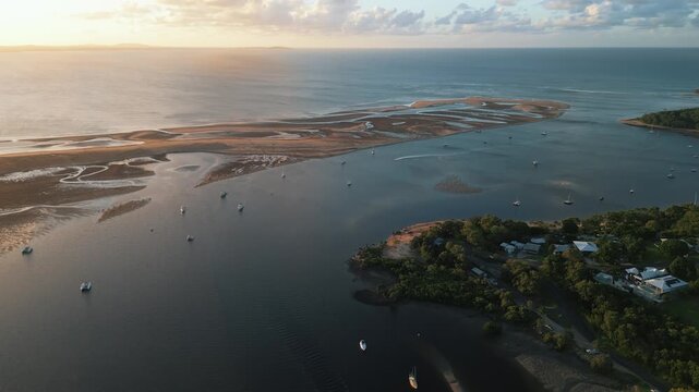 rone Footage of Tropical Queensland&rsquo;s Town of 1770 at Sunset &mdash; Golden Coastal Light, Coral Sea Views, and Gateway to the Great Barrier Reef&rsquo;s Pristine Marine Landscape