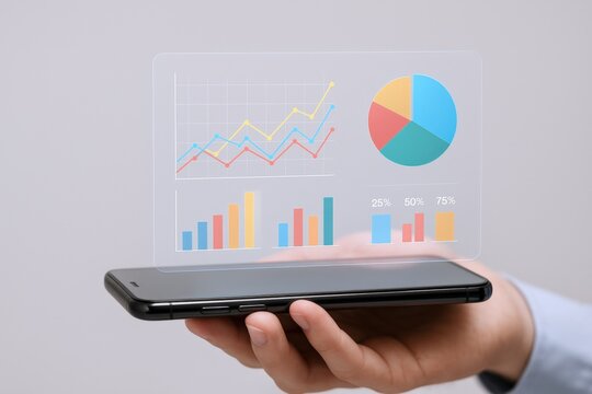 Mobile Data Visualization: Hand Holding Phone Displaying Interactive Charts, Graphs and Business Analytics, Modern Technology